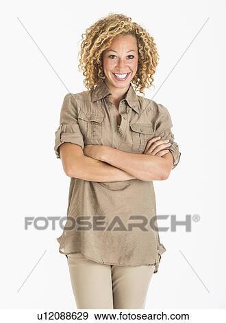 Portrait of smiling young woman, studio shot View Large Photo Image Stock Photo - Portrait of smiling young woman, studio shot. Fotosearch