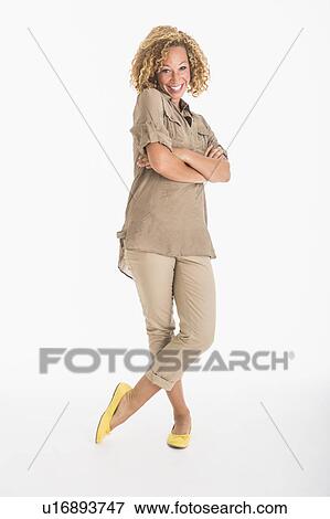 Portrait of smiling young woman, studio shot View Large Photo Image Stock Photo - Portrait of smiling young woman, studio shot. Fotosearch