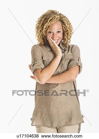 Portrait of smiling young woman, studio shot View Large Photo Image Stock Photo - Portrait of smiling young woman, studio shot. Fotosearch