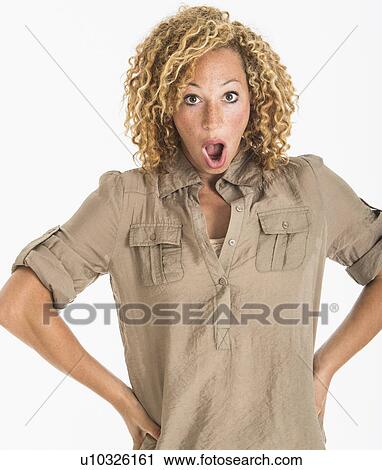 Portrait of surprised young woman, studio shot View Large Photo Image Stock Image - Portrait of surprised young woman, studio shot. Fotosearch