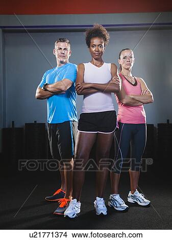 Portrait of three people in gym View Large Photo Image Picture - Portrait of three people in gym. Fotosearch