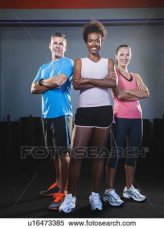 Portrait of three people in gym View Large Photo Image Stock Photography - Portrait of three people in gym. Fotosearch
