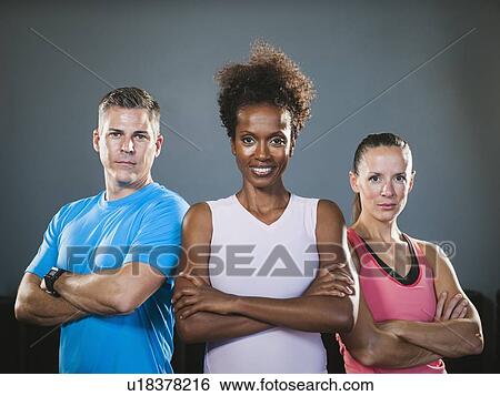 Stock Photograph - Portrait of three people with crossed arms. Fotosearch