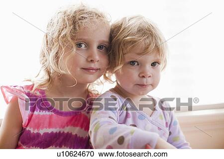 Portrait of two girls with blond hair View Large Photo Image Stock Image - Portrait of two girls with blond hair. Fotosearch