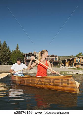 portrait of two young people paddling canoe View Large Photo Image Stock Photograph - portrait of two young people paddling canoe. Fotosearch