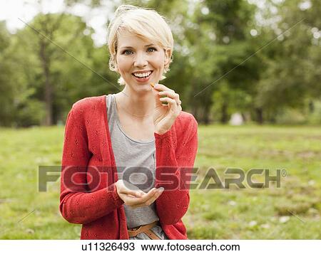 Portrait of woman eating View Large Photo Image Stock Image - Portrait of woman eating. Fotosearch