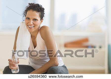 Portrait of woman in gym View Large Photo Image Stock Image - Portrait of woman in gym. Fotosearch