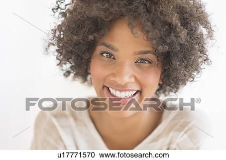 Portrait of woman laughing, studio shot View Large Photo Image Stock Image - Portrait of woman laughing, studio shot. Fotosearch