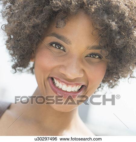 Stock Photograph - Portrait of woman smiling. Fotosearch