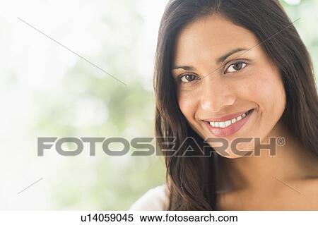 Stock Photography - Portrait of woman smiling. Fotosearch
