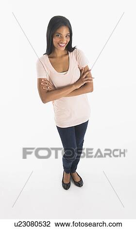 Portrait of woman smiling, studio shot View Large Photo Image Stock Image - Portrait of woman smiling, studio shot. Fotosearch