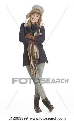 Stock Photo - Portrait of woman smiling, studio shot. Fotosearch