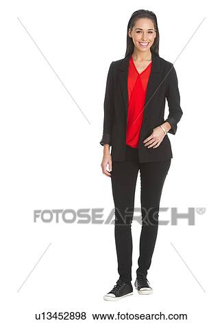 Stock Photo - Portrait of woman smiling, studio shot. Fotosearch