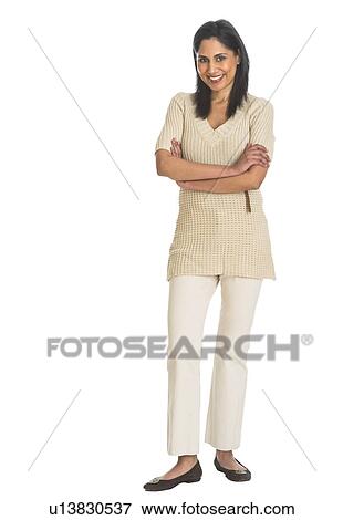 Stock Photo - Portrait of woman smiling, studio shot. Fotosearch