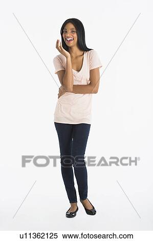 Portrait of woman smiling, studio shot View Large Photo Image Stock Photography - Portrait of woman smiling, studio shot. Fotosearch