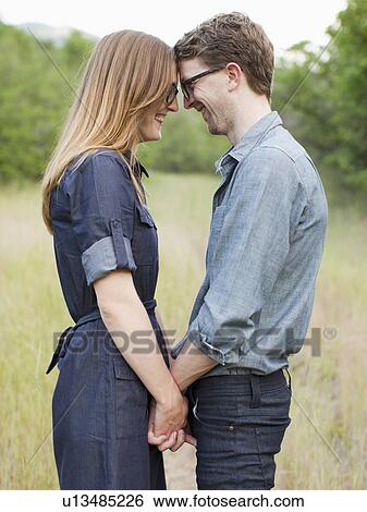 Stock Photograph - Portrait of young couple. Fotosearch