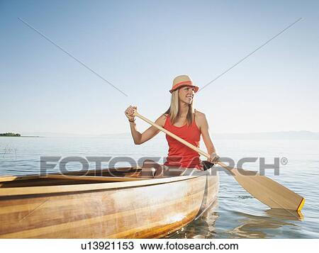 Portrait of young woman canoe traveling View Large Photo Image Stock Image - Portrait of young woman canoe traveling. Fotosearch