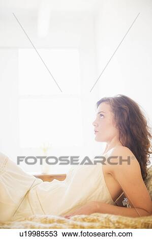 Portrait of young woman in white chemise View Large Photo Image Stock Image - Portrait of young woman in white chemise. Fotosearch