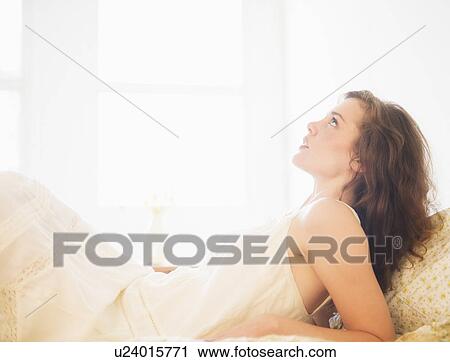 Portrait of young woman in white chemise View Large Photo Image Stock Image - Portrait of young woman in white chemise. Fotosearch