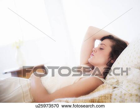 Portrait of young woman in white chemise View Large Photo Image Stock Image - Portrait of young woman in white chemise. Fotosearch