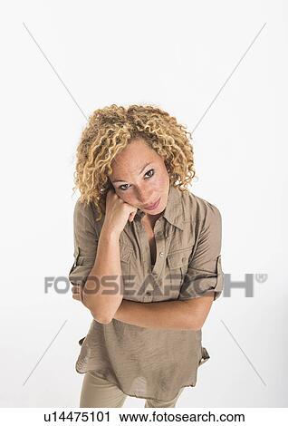 Portrait of young woman on white background, studio shot View Large Photo Image Stock Image - Portrait of young woman on white background, studio shot. Fotosearch