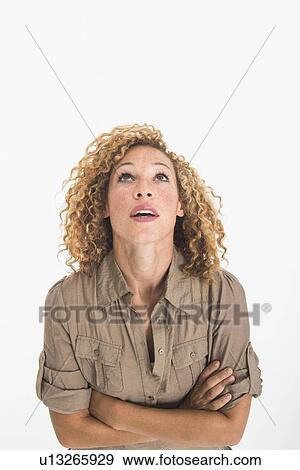 Portrait of young woman on white background, studio shot View Large Photo Image Stock Photo - Portrait of young woman on white background, studio shot. Fotosearch