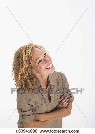Portrait of young woman on white background, studio shot View Large Photo Image Stock Photograph - Portrait of young woman on white background, studio shot. Fotosearch