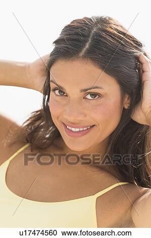 Stock Image - Portrait of young woman smiling. Fotosearch