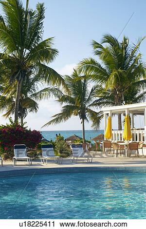 Stock Image - Resort pool and restaurant. Fotosearch
