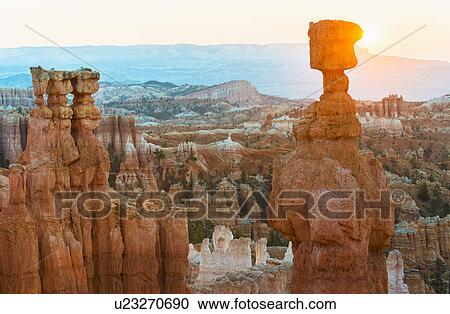 Stock Image - Rock formations at sunset. Fotosearch
