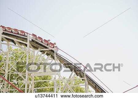 Roller coaster in amusement park View Large Photo Image Stock Image - Roller coaster in amusement park. Fotosearch