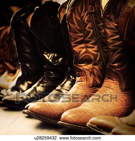 Stock Image - Row of cowboy boots. Fotosearch