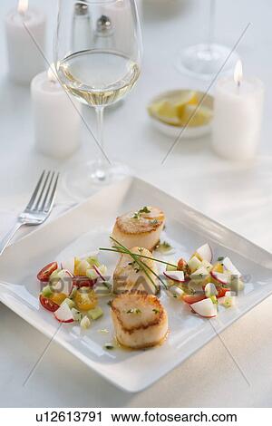 Seafood on plate in restaurant View Large Photo Image Stock Image - Seafood on plate in restaurant. Fotosearch