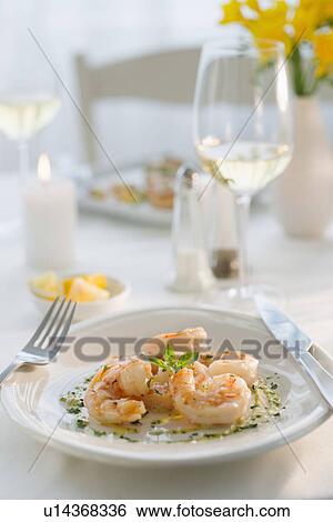 Stock Photograph - Seafood on plate in restaurant. Fotosearch