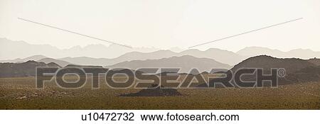 Several mountain ranges backlit by morning sun View Large Photo Image Stock Image - Several mountain ranges backlit by morning sun. Fotosearch