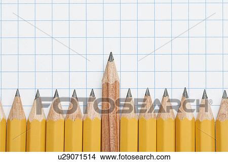 Single wooden pencil rising above row of sharpened pencils on graph paper, studio shot View Large Photo Image Picture - Single wooden pencil rising above row of sharpened pencils on graph paper, studio shot. Fotosearch