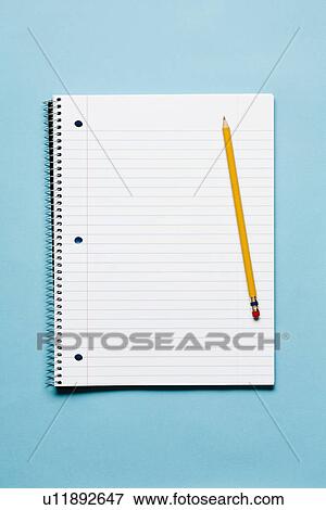 Single yellow sharpened pencil with blank spiral notebook on blue background View Large Photo Image Stock Photo - Single yellow sharpened pencil with blank spiral notebook on blue background. Fotosearch