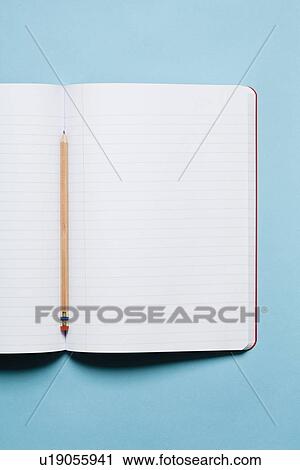 Singlewooden sharpened pencil with blank composition notebook View Large Photo Image Stock Image - Singlewooden sharpened pencil with blank composition notebook. Fotosearch