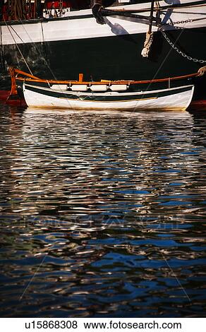 Small boat and water ripples View Large Photo Image Stock Photo - Small boat and water ripples. Fotosearch