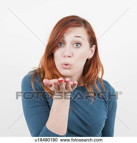 Studio shot, Girl blows kiss View Large Photo Image Stock Image - Studio shot, Girl blows kiss. Fotosearch