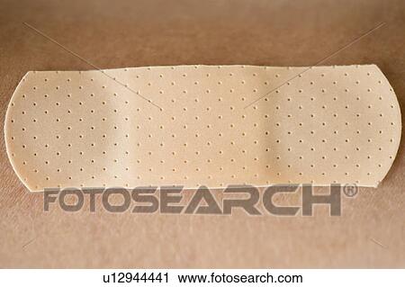 Stock Image - Studio shot of adhesive bandage. Fotosearch