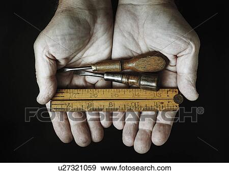 Studio shot of hands holding antique tools View Large Photo Image Stock Photo - Studio shot of hands holding antique tools. Fotosearch