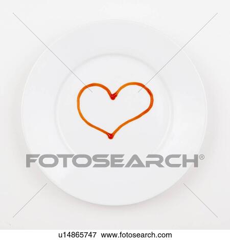Stock Photo - Studio shot of plate with heart made of ketchup. Fotosearch