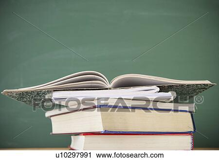 Stock Image - Studio shot of stack of books. Fotosearch