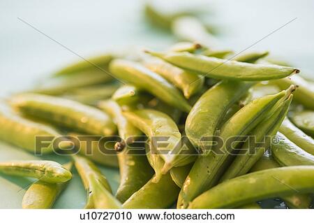 Stock Image - Studio Shot of Sugar Snap Peas. Fotosearch