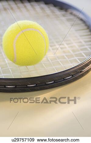 Studio Shot of tennis racket with ball View Large Photo Image Stock Photo - Studio Shot of tennis racket with ball. Fotosearch