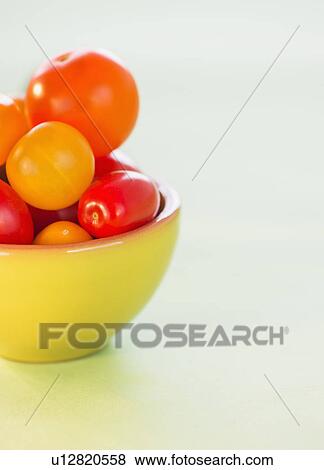 Studio Shot of tomatoes in bowl View Large Photo Image Stock Photo - Studio Shot of tomatoes in bowl. Fotosearch