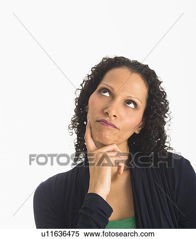 Studio shot of woman contemplating View Large Photo Image Stock Photography - Studio shot of woman contemplating. Fotosearch