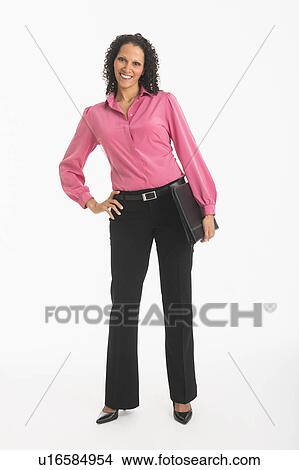Studio shot of woman standing View Large Photo Image Picture - Studio shot of woman standing. Fotosearch