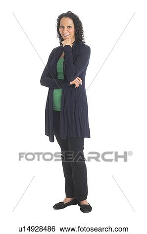 Stock Photograph - Studio shot of woman standing. Fotosearch